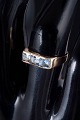 14 carat gold ring with light blue synthetic spinels.