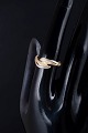 8 carat gold ring with four white stones.