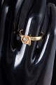 8 carat gold ring with white stone.