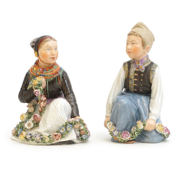 Two figures by Carl Martin Hansen for Royal Copenhagen. #12412 & 12414. H: 
13,2&14,7cm.