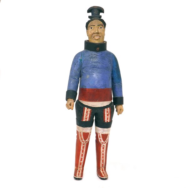 Johannes Kreutzmann figur. Johannes Kreutzmann, 1862-1940, figur af træ 
forestillende gravid grønlandsk kvinde. Hjembragt af Knud Rasmussen. H: 44cm